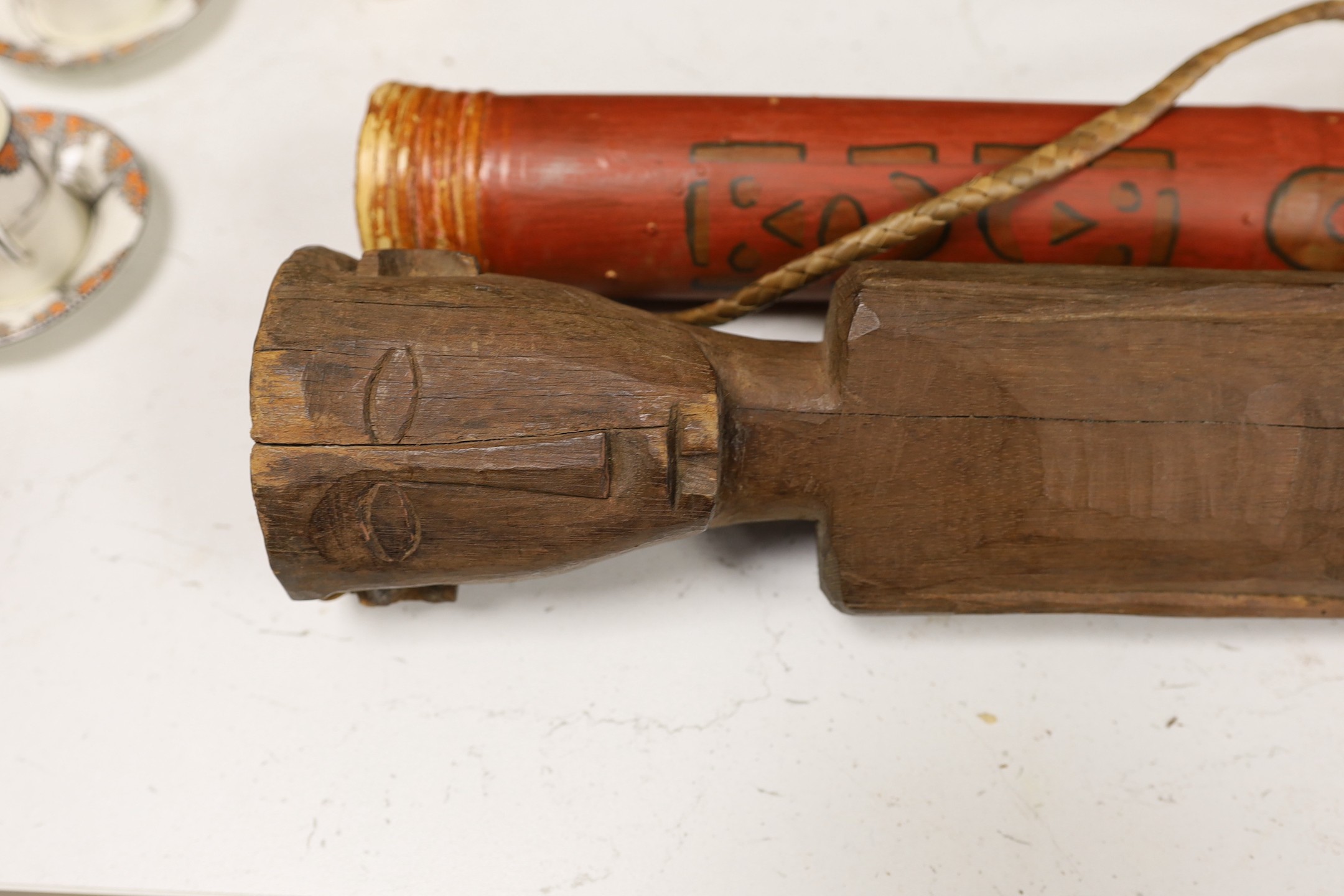 A Chinese wood grave figure possibly Han, 85.5cm high, with wooden musical rain stick